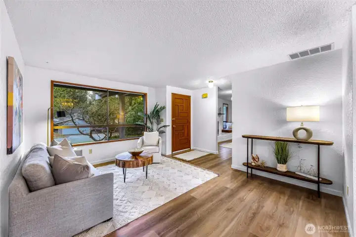 Large southern windows in this light filled living room. Large southern windows in this light filled living room.