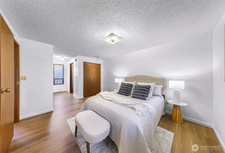 Full primary suite with attached bathroom and several closets. Full primary suite with attached bathroom and several closets.