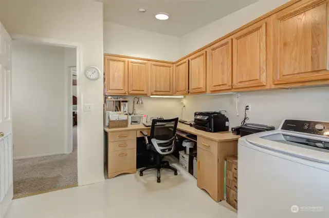 Utility room. So much storage AND an office! Opens to back patio.