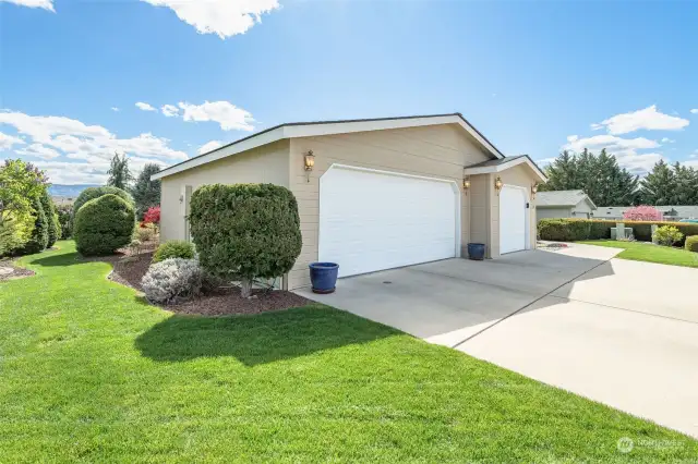 Immaculate landscape surrounds this lovely home