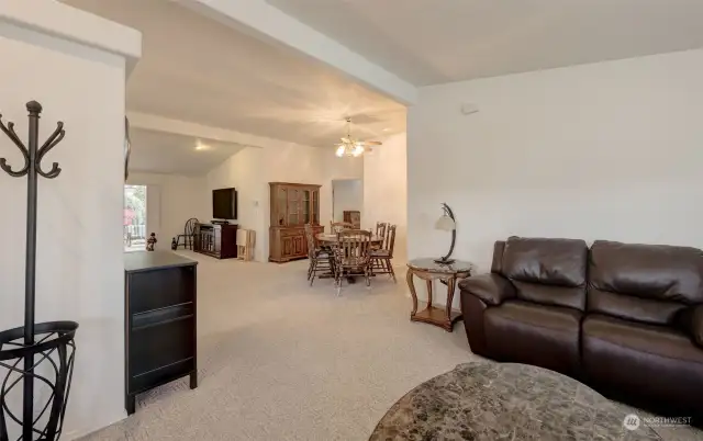 Step on in to a large front living room, open to the formal dining room and family room