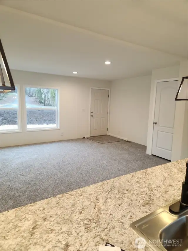 View from the kithcen island to the open concept living room