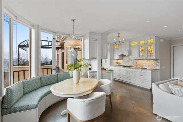 . . . a custom built curved banquette with storage to facilitate your casual dining, with beautiful southern light pouring in through generous windows.