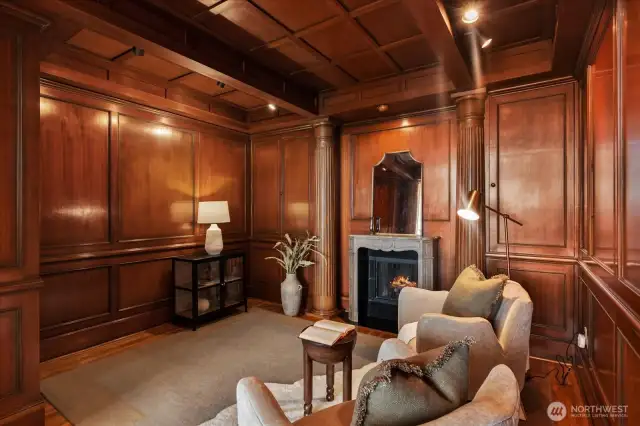 Just off the grand living space is a cozy walnut paneled den with gas fireplace and a couple of other secrets. . .to be shown . . .