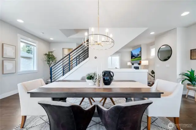 The well-appointed dining with a designer chandelier.