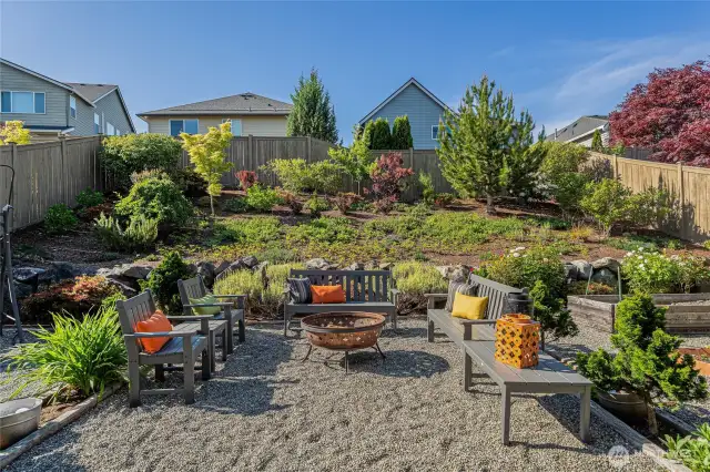 This backyard is full of color and was designed to be low maintenance so you can work less and relax more.