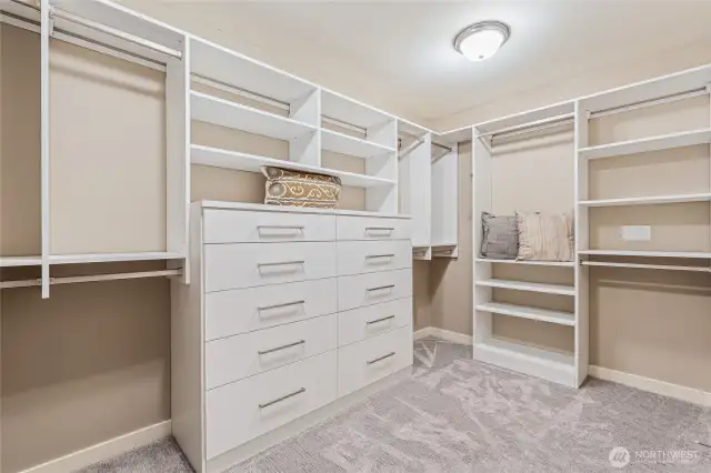 Primary suite closet with newer California Closet built-ins are a bonus.