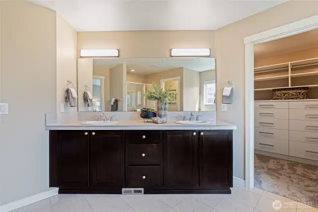 Dual sinks and plenty of cabinets and drawers to store your personal items.