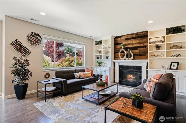Great room with vaulted ceilings, gas fireplace, and new custom built-ins.