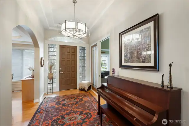 High ceiling entry with updated light fixture.  Office entry (shown to the right)