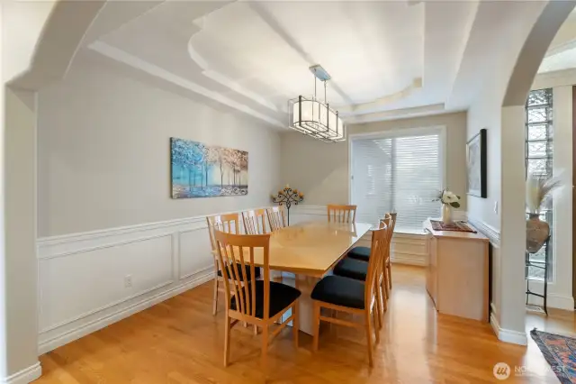 Dining room with wainscot & upgraded light fixture.  Enjoy entertaining with ease