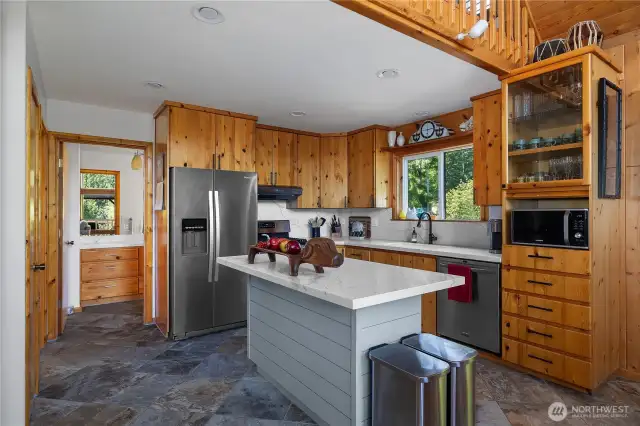 Kitchen with island. Open and airy. walk-in pantry too.