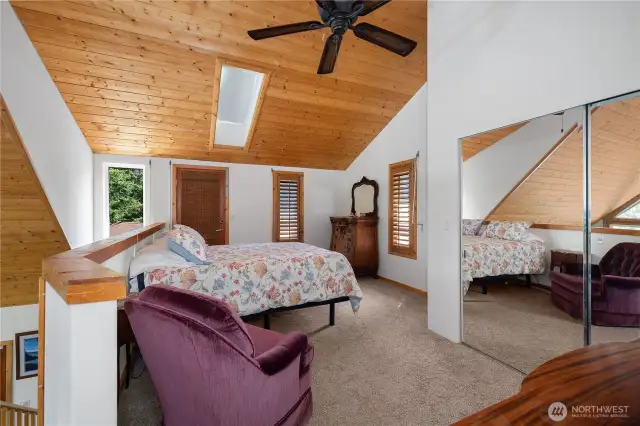 Bedroom 2 with ceiling fan and a juliet balcony.