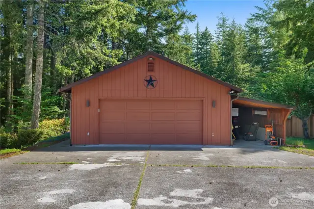 2 car garage with attached car port.  3rd car parking on the back right side.