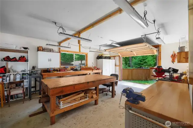 Shop with garage door for boat or golf cart parking.