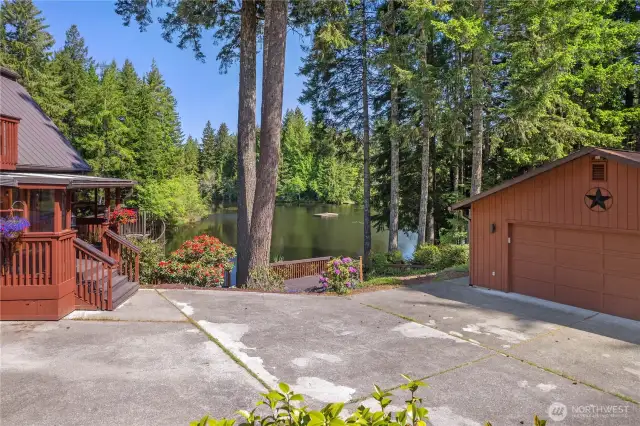 Poured driveway with a privacy gate to enter.