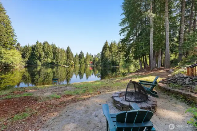 Firepit and sitting area with a no bank beach.