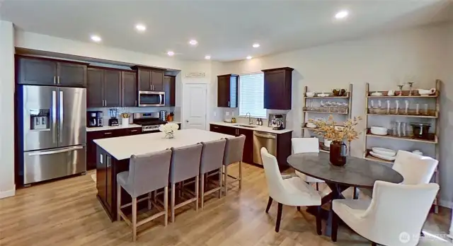 Island kitchen with breakfast area