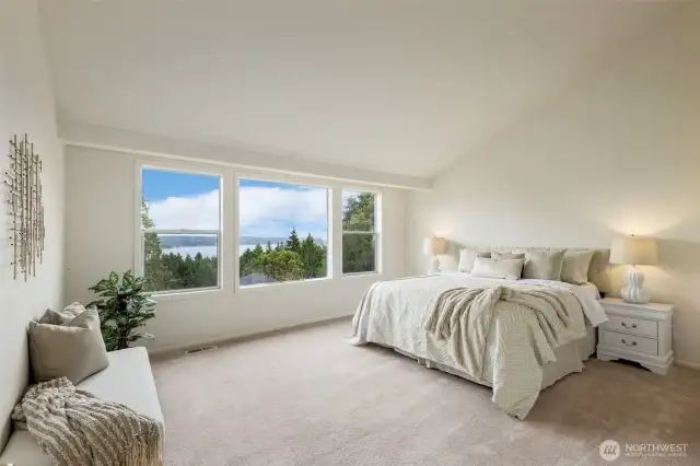 Wake up to stunning views of the water and treetops from the comfort of your generous primary suite. Vaulted ceilings and soft natural light create a calm and restorative retreat.