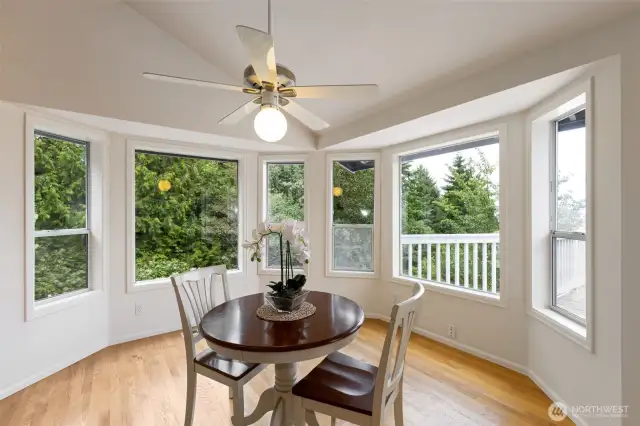 Nestled into a bay window alcove, this charming breakfast nook is the perfect place to start your day. Surrounded by trees, it feels like your own personal treehouse retreat.