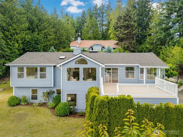 A spacious deck, large windows, and lush greenery all around. What more could you ask for!