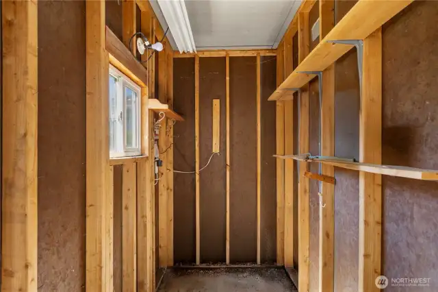 Spacious storage unit in front of carport