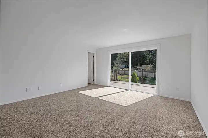 Primary bedroom has brand new french doors leading to its private deck