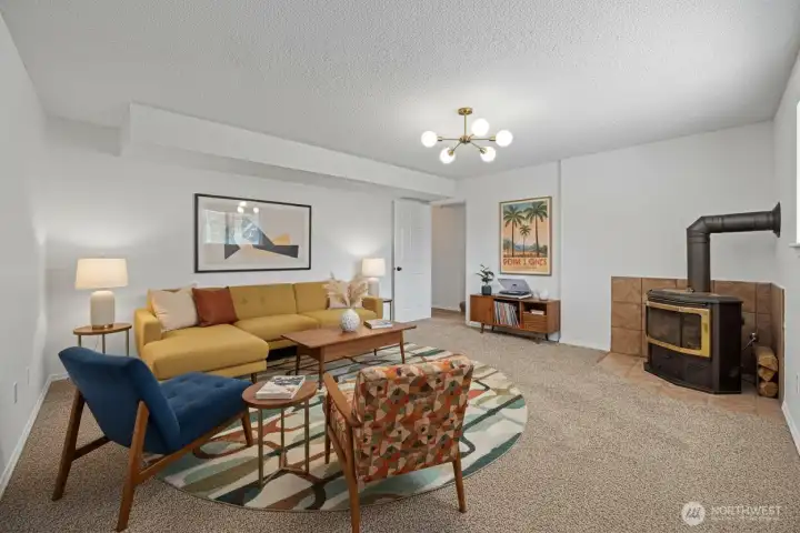 The virtually staged living room with a cozy wood burning stove