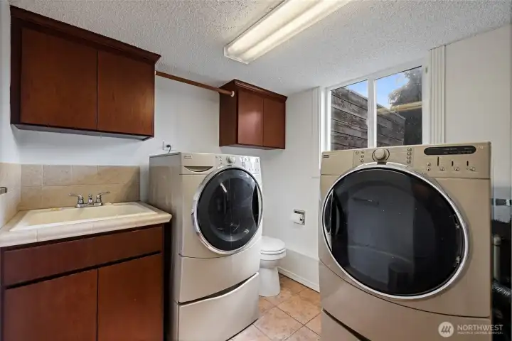 Downstairs laundry also is a half bath