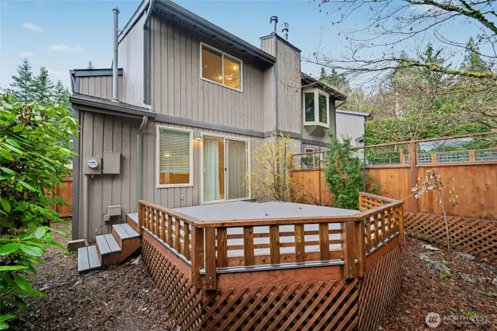 Townhouse-style condo has private backyard with deck