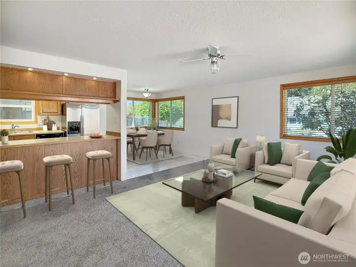 Kitchen has eat in counter, dining space overlooks the living room. Living room has sliders leading to deck and fenced yard. There is also access to the backyard off the familyroom.