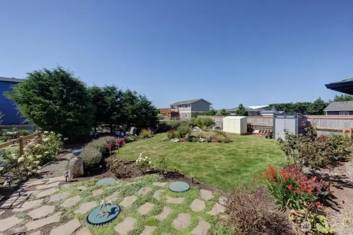 Manicured Back Yard with fire pit