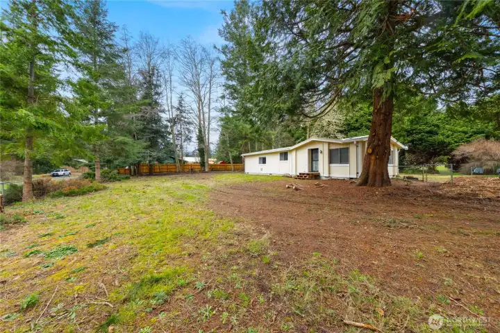 Nestled among evergreens, this cozy single-level Northwest living.