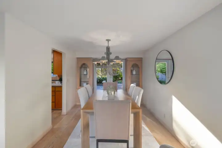 Dining area with locking built in cabinets on either side of french doors
