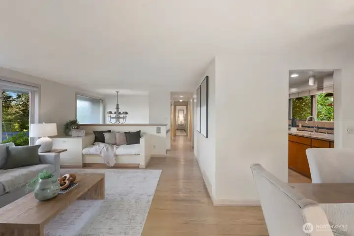 Long hallway leads to primary bedroom & bath