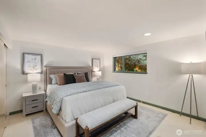 Primary Bedroom with views of backyard