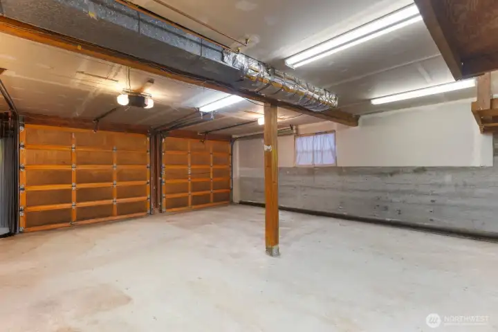 Spacious 2 car garage with shelving & storage  area