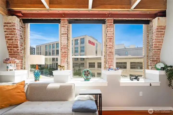 Sunlight pours through the expansive southwest-facing windows, filling the home with natural light. Sunlight pours through the expansive southwest-facing windows, filling the home with natural light.