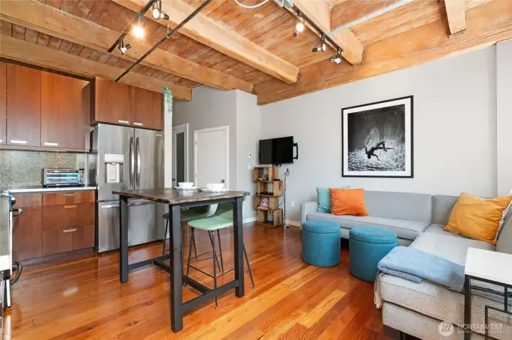 The open-concept kitchen features stainless steel appliances and plenty of room for a cozy bistro dining area. The open-concept kitchen features stainless steel appliances and plenty of room for a cozy bistro dining area.