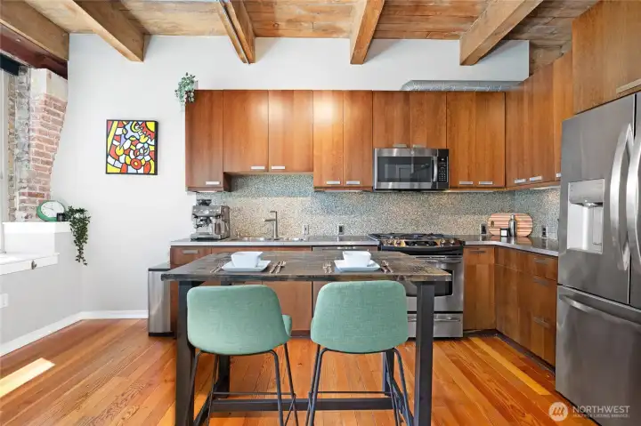 Exposed car decking and original beams showcase the authentic industrial charm of this beautiful loft. Exposed car decking and original beams showcase the authentic industrial charm of this beautiful loft.