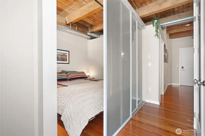 The frosted glass sliding door provides privacy while maintaining the loft's open, airy feel. The frosted glass sliding door provides privacy while maintaining the loft's open, airy feel.