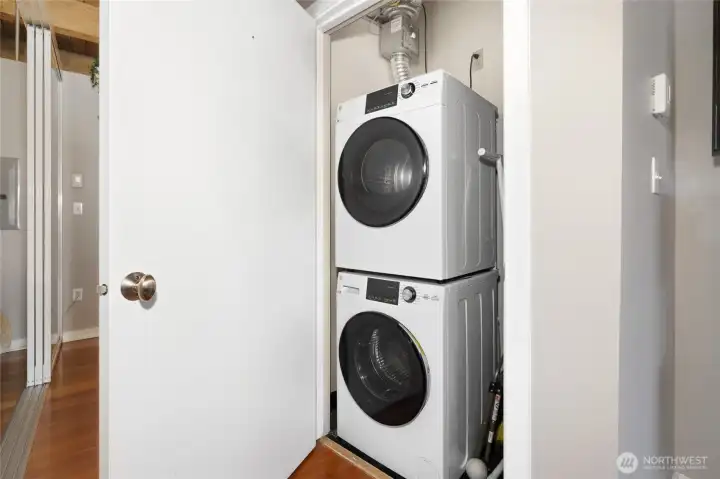 Convenient utility closet with a stackable washer and dryer. Convenient utility closet with a stackable washer and dryer.
