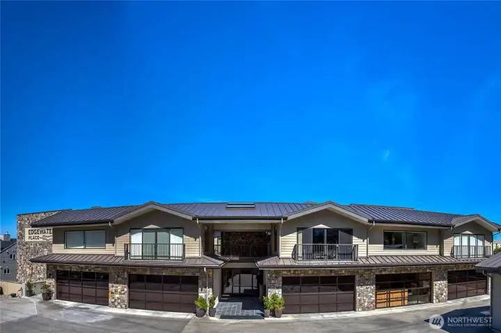 Welcome to Edgewater Place Condominiums! Looking at the building from the street, you will see the 2nd garage from the left is the one that transfers with this sale, and the glass has been replaced in the second garage from the right so that it matches the others now. There are 52 augured pilings in the bedrock below these well built condos.