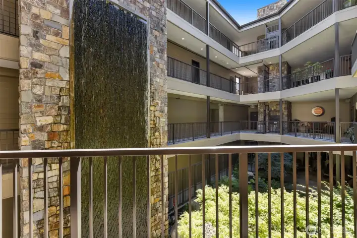 The water feature in the open aired common area adds to the ambiance and muffles the sounds giving privacy to the sitting areas at each of the center unit's front entries.