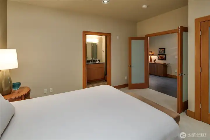 The second bedroom has frosted glass French doors, a large closet, and a 3/4 bath with a zero clearance shower.