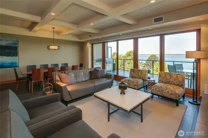 The floor plan is open and the triple pane hurricane glass sliding doors open onto the deck that runs the full width of the condo. The ceiling defines the rooms so nicely.