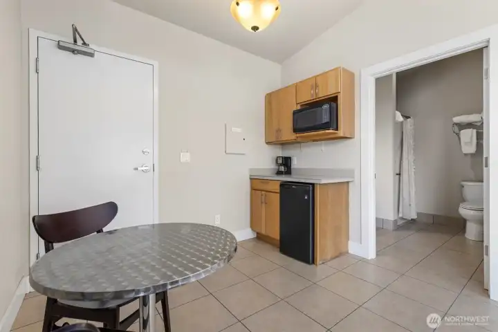 Another view of the guest suite showing the kitchenette and little dining area, as well as the 3/4 bath.