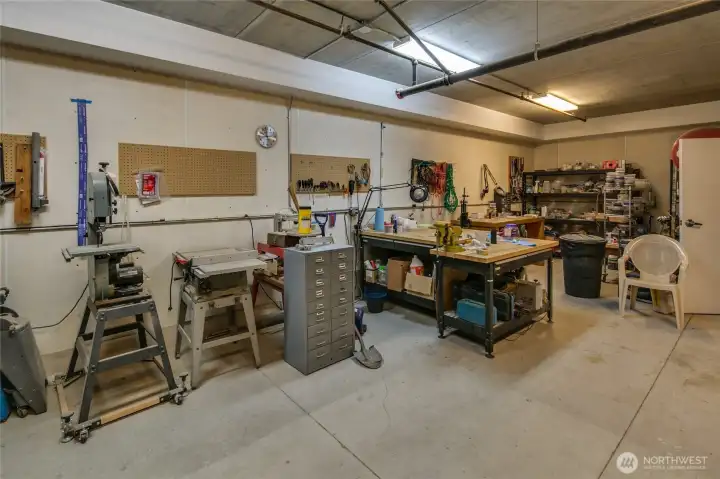 Another view of the workshop...before it was improved! There is a half bath and it opens to the hallway with the storage units.