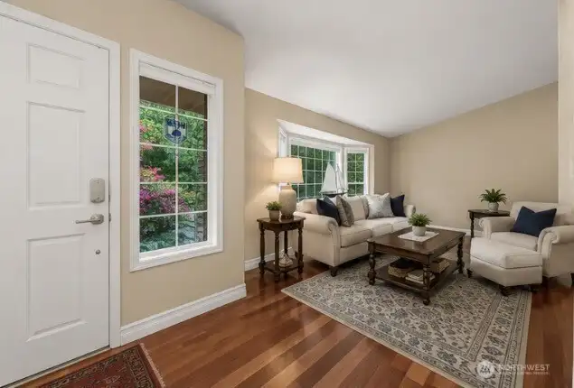 Entry, foyer, and living room, main level.  *virtually staged