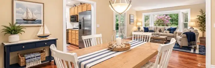 Dining Room w/ view of living room, main level  *virtually staged